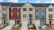 Bright townhouses showcasing diverse colors and modern architecture in Fuquay-Varina, NC.